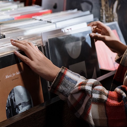 hands searching through vinyl records